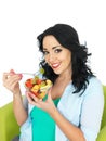 Young Healthy Woman Eating a Fresh Fruit Salad Royalty Free Stock Photo