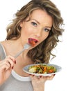 Young Healthy Woman Eating a Fresh Garden Mixed Salad Royalty Free Stock Photo