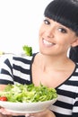 Young Healthy Woman Eating a Healthy Fresh Green Leafed Salad with Tomato Royalty Free Stock Photo