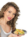 Young Healthy Woman Eating a Prawn and Mango Salad Royalty Free Stock Photo