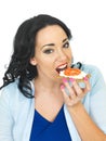 Young Healthy Woman Eating a Wholegrain Cracker with Cottage Cheese and Fresh Tomato