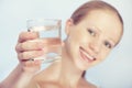 Young healthy woman and a glass of clean water Royalty Free Stock Photo