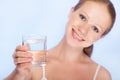 Young healthy woman and a glass of clean water Royalty Free Stock Photo