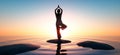 Woman practicing yoga at sunset time Royalty Free Stock Photo