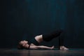 Young healthy woman practicing yoga ondoors