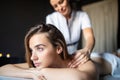 Young and healthy woman in spa salon. Traditional Swedish massage therapy Royalty Free Stock Photo