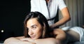 Young and healthy woman in spa salon. Traditional Swedish massage therapy Royalty Free Stock Photo