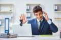 The young help desk operator working in office Royalty Free Stock Photo