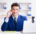 Young help desk operator working in office Royalty Free Stock Photo