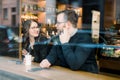 A young heterosexual couple enjoying a conversation at a nyc coffee shop Royalty Free Stock Photo