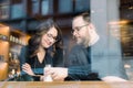 A young heterosexual couple enjoying a conversation at a nyc coffee shop Royalty Free Stock Photo