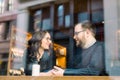 A young heterosexual couple enjoying a conversation at a nyc coffee shop Royalty Free Stock Photo