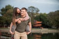 Young couple in love having fun at the beach, piggyback ride Royalty Free Stock Photo