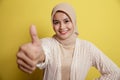 young hijab women happy and show the thumb up