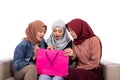 Young hijab women surprised open their shopping bag