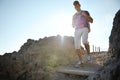 Young hiker with backpack walking between rock mountain Royalty Free Stock Photo