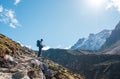 Young hiker backpacker man enjoying valley view in Makalu Barun Park route near Khare during high altitude acclimatization walk. Royalty Free Stock Photo