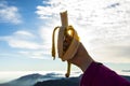 Young hiker enjoying eating banana in Puigsacalm peak, La Garrotxa, Spain Royalty Free Stock Photo