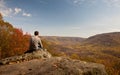 Young hiker relaxing on rock