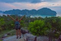 Travel tourist standing with arms up in the air enjoying beautiful view over Phi Phi Don island in Thailand Royalty Free Stock Photo