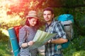 Young Hikers looking into Map on Forest Trail Royalty Free Stock Photo