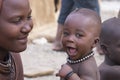A young Himba mother with her child.