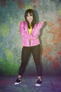 Young hip hop dancer in a pink jacket on studio Royalty Free Stock Photo