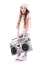 Young hip hop girl listening music on boombox retro radio, ghetto blaster, isolated on white background Royalty Free Stock Photo