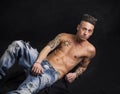 Young hip man in jeans, shirtless, isolated on Royalty Free Stock Photo