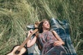Young hippie woman sleeping on mowed grass Royalty Free Stock Photo
