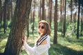 Young hippie woman walks in the summer forest laughs dances and enjoys life and nature Royalty Free Stock Photo