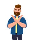 Young hipster bearded man crossing arms and saying no gesture. Person making X shape, stop sign with hands and negative expression