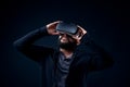 Young hipster bearded man wearing virtual reality goggles. Royalty Free Stock Photo