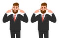 Young hipster businessman covering his ears with fingers, eyes closed. Trendy bearded person closing or plugging for loud noise. Royalty Free Stock Photo