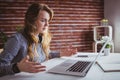 Young hipster businesswoman misunderstanding her laptop Royalty Free Stock Photo