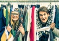 Young hipster couple in love at the weekly cloth market Royalty Free Stock Photo