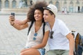 young hipster couple taking selfie while on city break Royalty Free Stock Photo