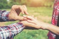 Young hipster couple wearing engagement ring in nature,Sweet and Royalty Free Stock Photo