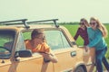 Young hipster friends on road trip on a car Royalty Free Stock Photo