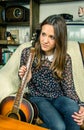 Young hipster girl with acoustic guitar at home Royalty Free Stock Photo