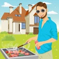 Young hipster man barbecuing meat on the grill