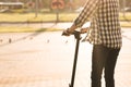 Young hipster man business guy riding on fast electric scooter having fun on road in open landscape in the morning light Royalty Free Stock Photo