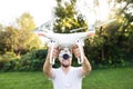 Young hipster man holding drone. Sunny green nature. Royalty Free Stock Photo