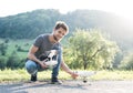 Young hipster man holding drone. Sunny green nature. Royalty Free Stock Photo