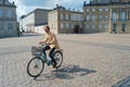 hipster riding bicycle in Copenhagen