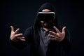 Young hipster man wearing virtual reality goggles. Black background studio VR concept Royalty Free Stock Photo