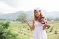 Young hipster musician woman playing violin in the nature outdoor lifestyle behind mountain Royalty Free Stock Photo