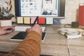 Young hipster photographer using digital graphic tablet while working in modern office, professional retoucher sitting at modern Royalty Free Stock Photo