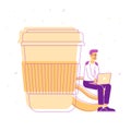 Young Hipster Sit with Laptop in Hands on Coffee Bean near Huge Plastic Cup with Hot Beverage Isolated