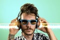 Young hipster tattooed man, listening to music Royalty Free Stock Photo